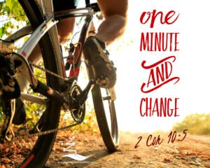 Cyclist going up a hill on a dirt road on a mountain bike