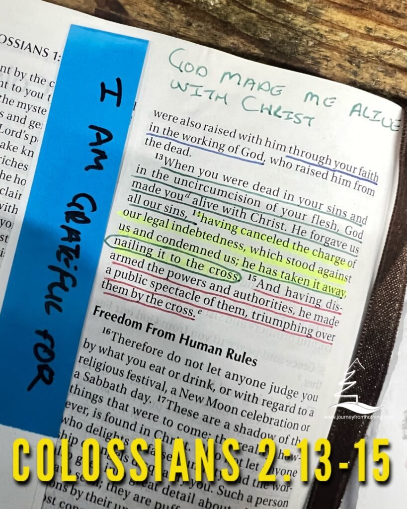 The Bible verse Colossians 2:13-15 highlighted and marked in a bible